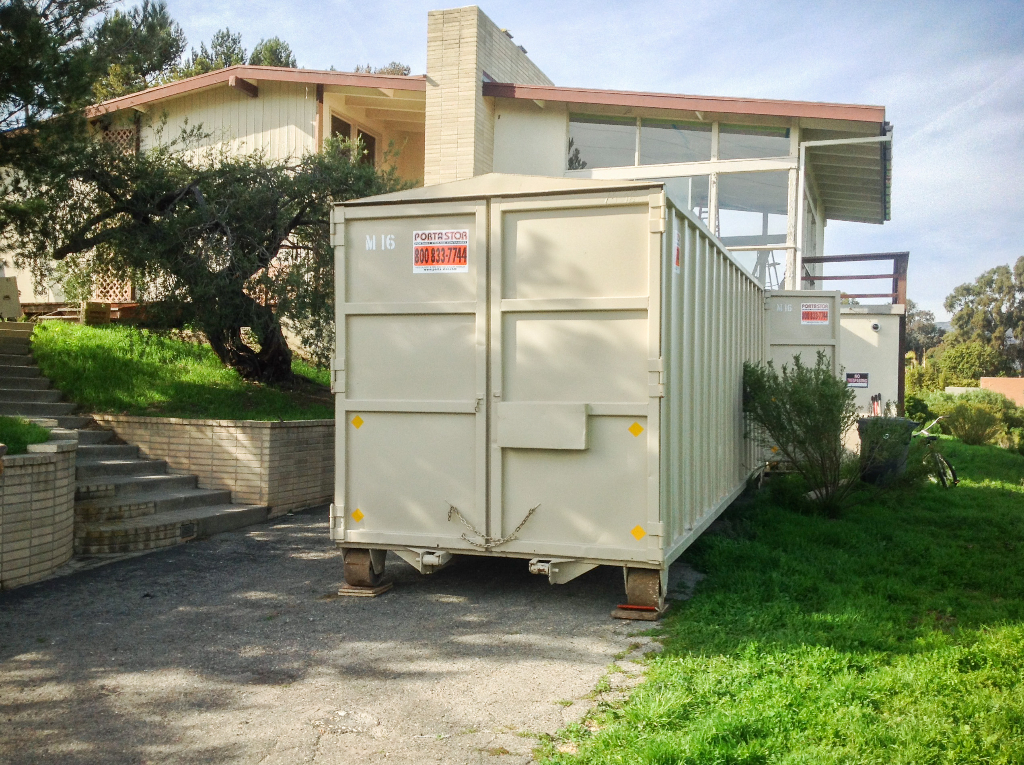 26ft container on wood to protect the driveway.